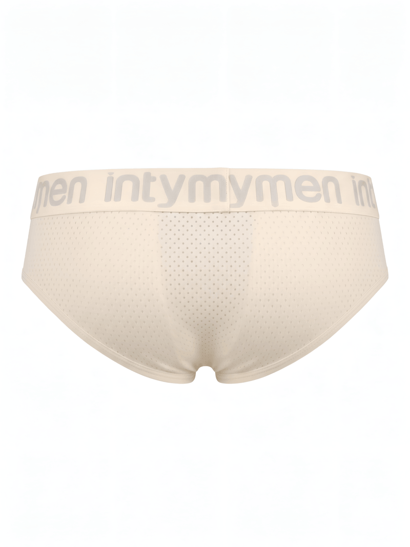 Brief masculino beige Intymen vista posterior con paneles perforados sobre fondo blanco.
