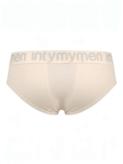 Brief masculino beige Intymen vista posterior con paneles perforados sobre fondo blanco.

