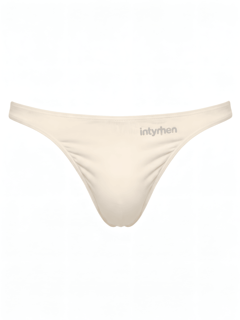 Tanga masculina beige Intymen sobre fondo blanco.