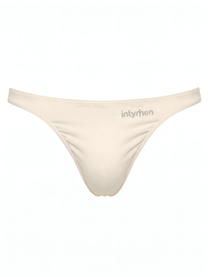 Tanga masculina beige Intymen sobre fondo blanco.